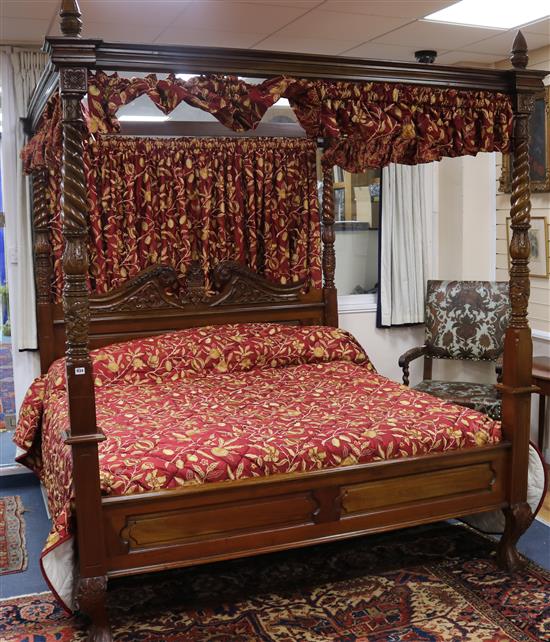 A large George III style mahogany four poster bed W. 6ft 6in. H.7ft 7in.